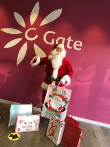 Santa at the C-Gate Dundee with some of the gifts donated by staff at BT Dundee for young carers across Dundee. 
