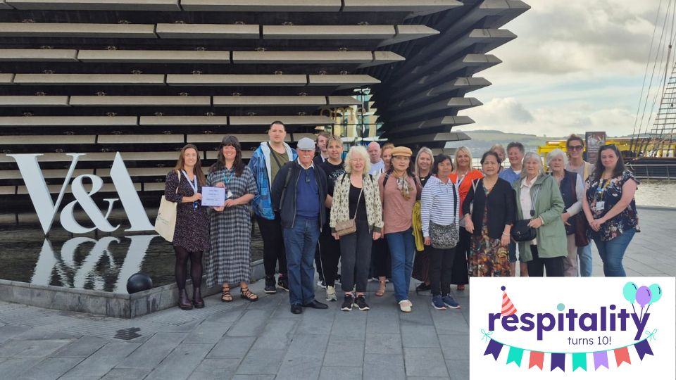 Group photo of carers and Dundee Carers Centre staff outside the V&A Dundee.