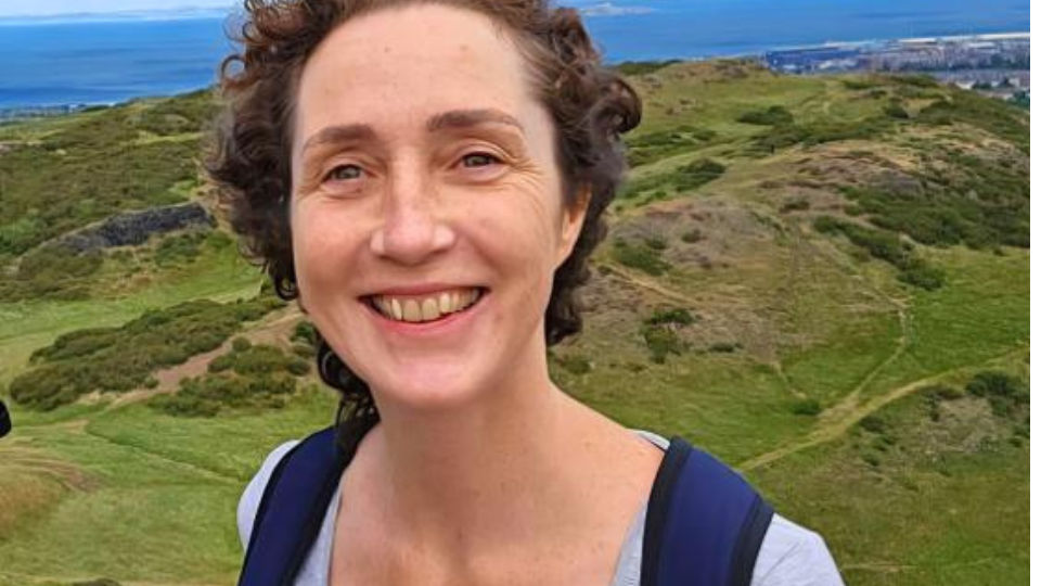 Image of Maressa, student counsellor with a mountainous background.