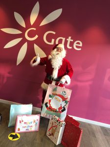 Santa at the C-Gate Dundee with some of the gifts donated by staff at BT Dundee for young carers across Dundee. 