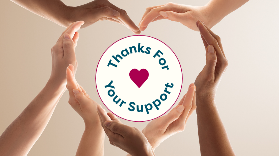 Hands grouped together to form a shape of a heart. Circle graphic in the middle of the heart that says 